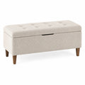 Banco de almacenamiento tapizado beige con patas de madera